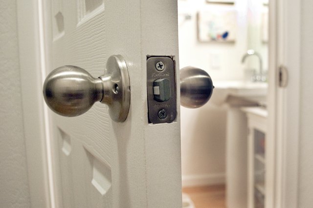 How to Unlock a Locked Bathroom Door(chris hansen/Demand Media)